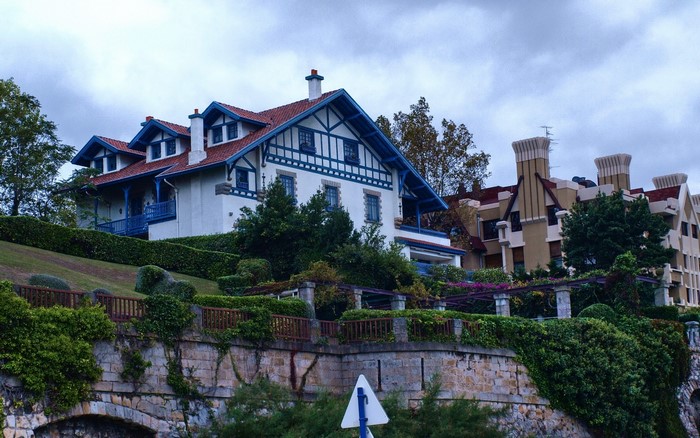 White house with blue trim and red roof in Spain