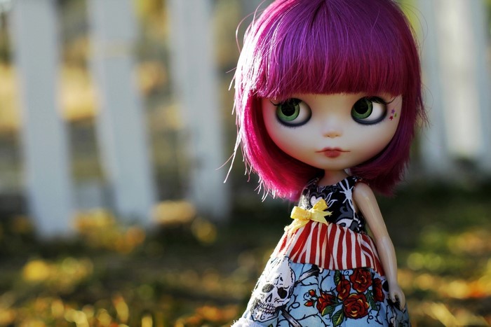 Doll with purple hair and a patterned dress