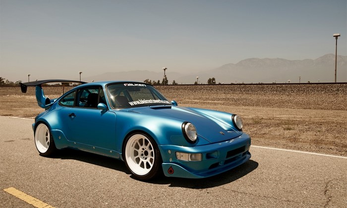 Blue Porsche 911 with large rear spoiler