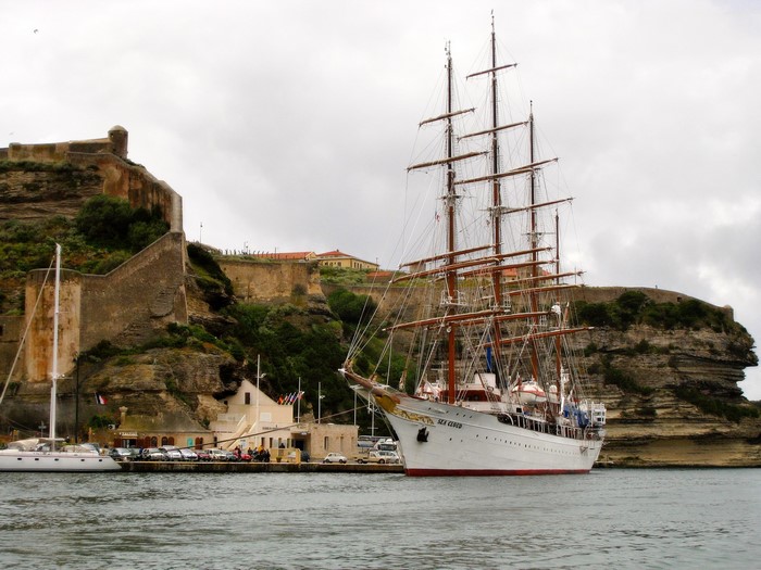 Sea Cloud tall ship docked near a fortress