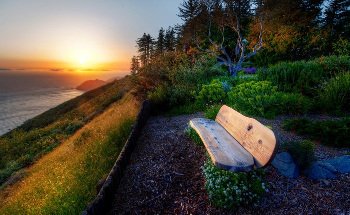 Bench overlooking the ocean at sunset