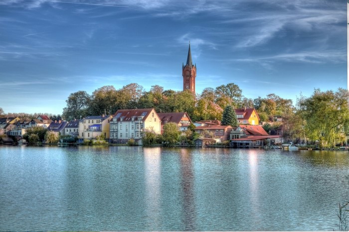 Town with church tower on a lake in Germany