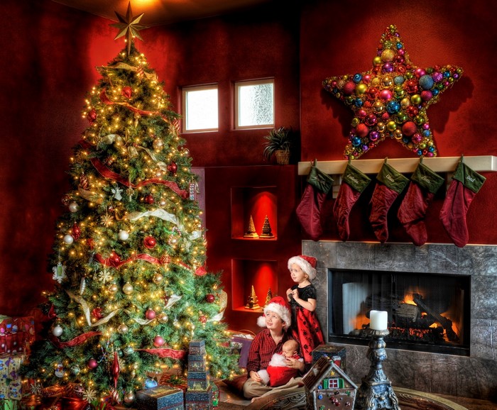 Christmas scene with family by the fireplace