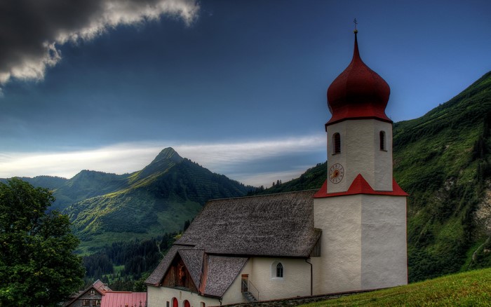 Church with red dome in Austrian mountains