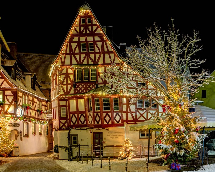 Half-timbered houses decorated with Christmas lights in Ediger-Eller, Germany at night