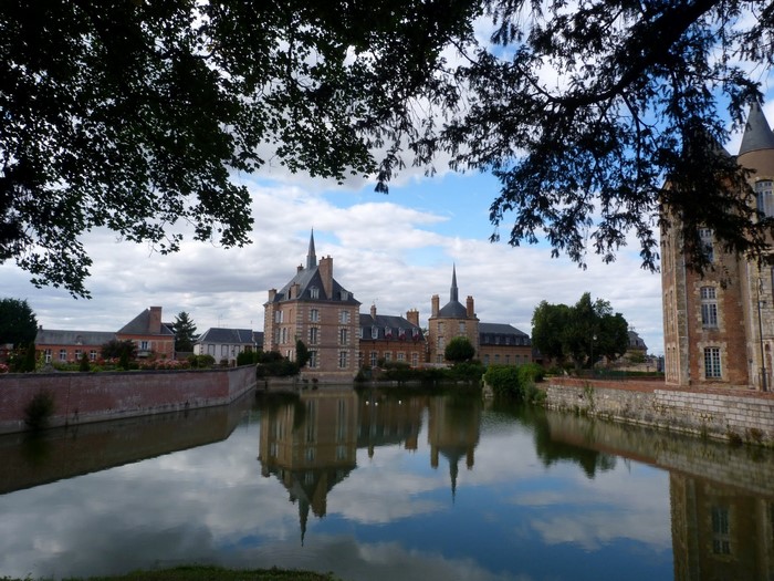 Chateau reflected in a moat in France