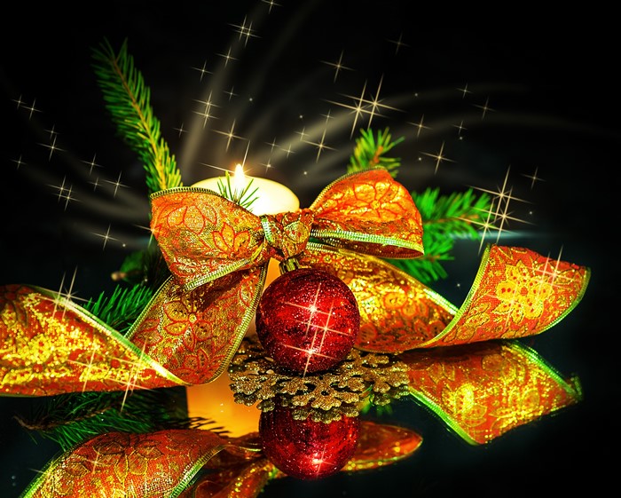 Christmas candle with ribbon and ornaments
