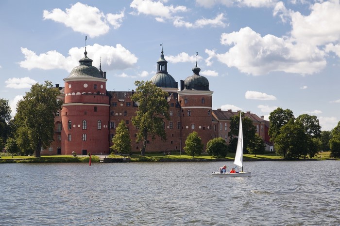 Gripsholm Castle, Sweden, with sailboat on lake