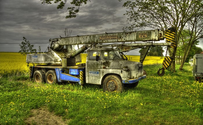 Old Tatra 148 crane truck in a field