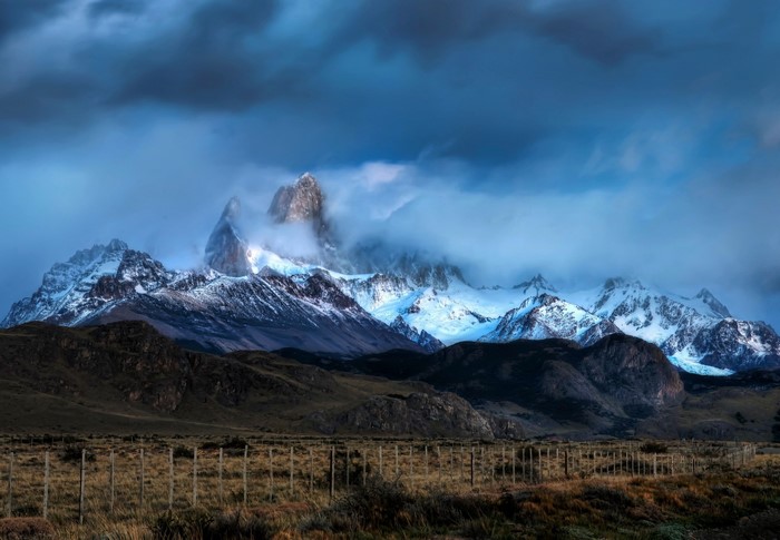 Snow-capped mountains in Argentina under cloudy skies