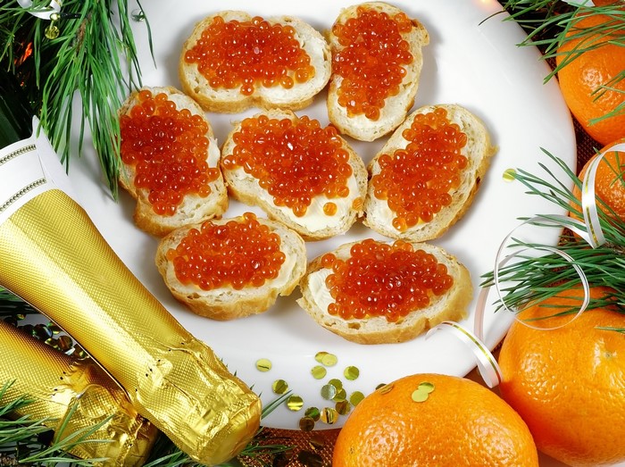 Caviar on bread with champagne and tangerines