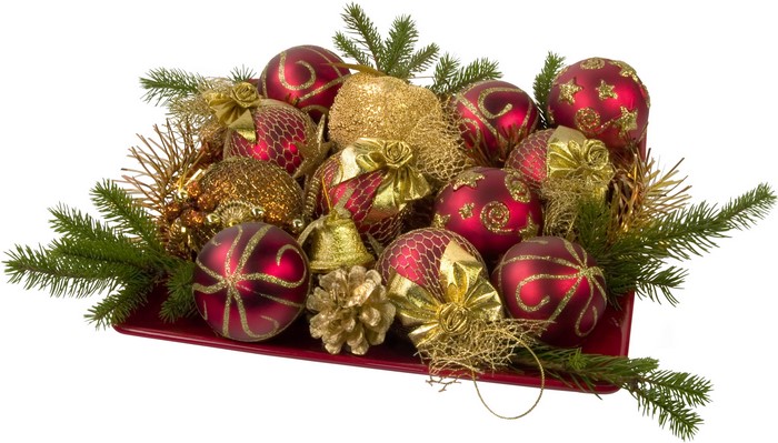 Christmas ornaments and pine branches on a red tray