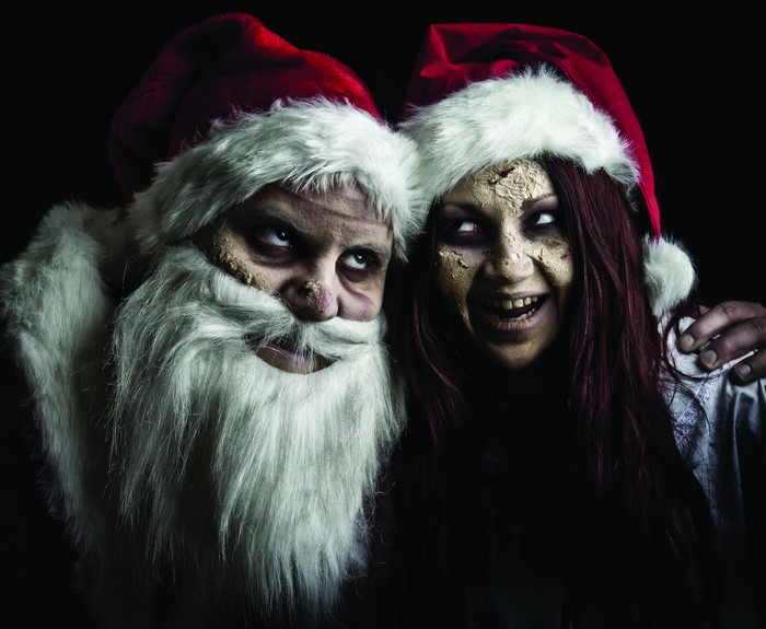 Two zombies dressed as Santa Claus