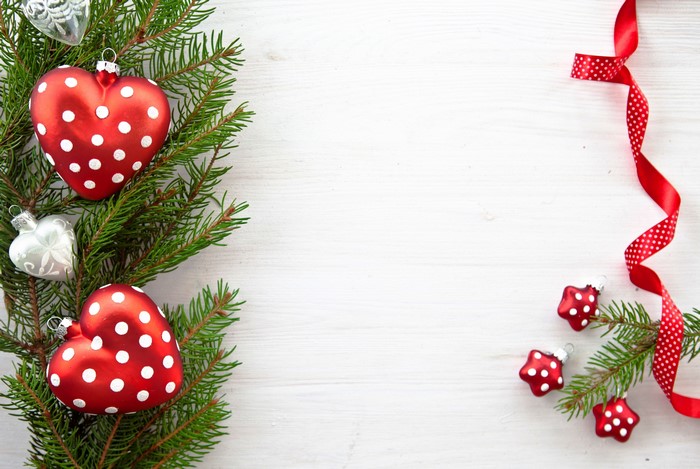 Christmas tree branches with ornaments and ribbon