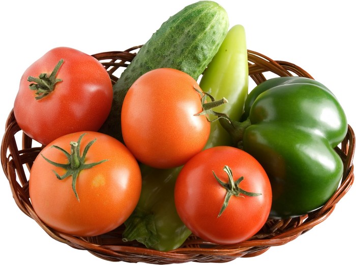Basket of fresh tomatoes, cucumbers, and bell peppers