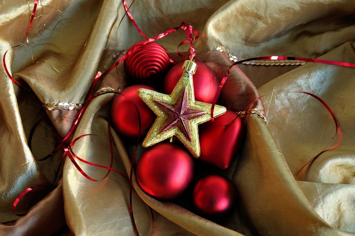 Christmas ornaments on golden fabric