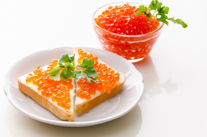 Toast with butter and red caviar