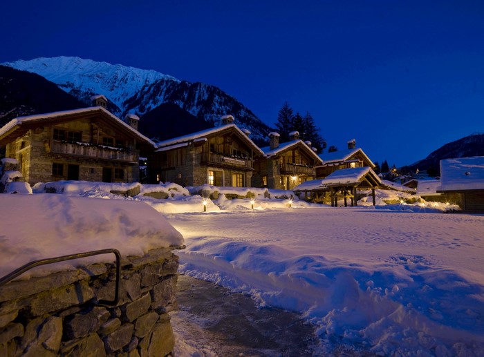 Snowy mountain village at dusk