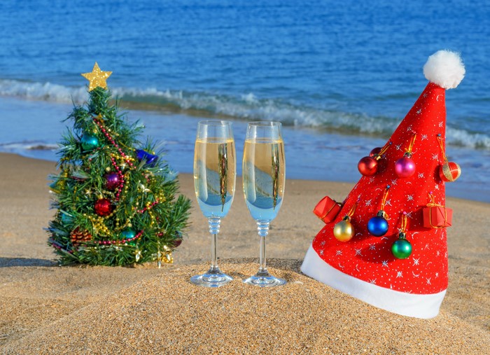 Christmas tree and champagne on the beach