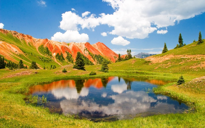 Red Mountains Reflecting in a Pond