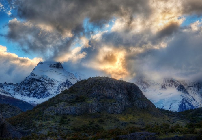 Snow-capped mountains under dramatic clouds in Argentina