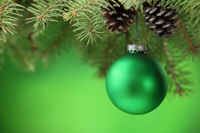 Green Christmas Ornament on Pine Branch with Pine Cones