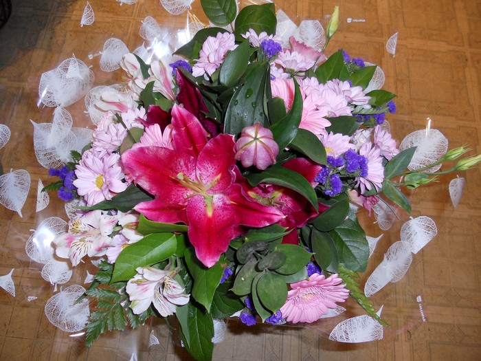 Bouquet of pink and red lilies and daisies