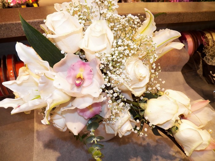 White roses and orchids bouquet