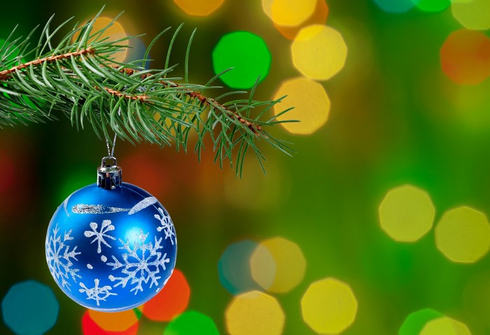 Blue Christmas Ornament on Pine Branch with Bokeh Lights