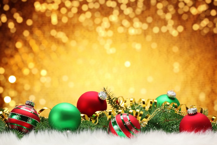 Christmas ornaments on a golden bokeh background