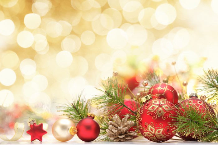Christmas ornaments and pine branches with bokeh background