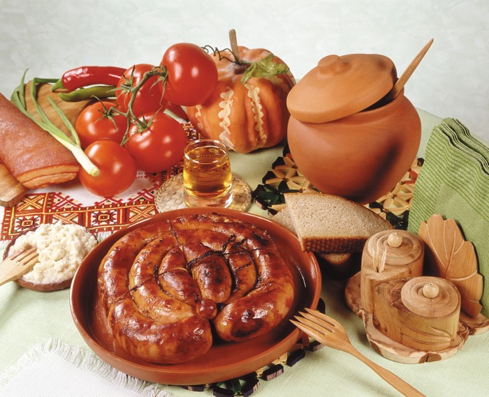 Still-life with sausage, tomatoes, and bread