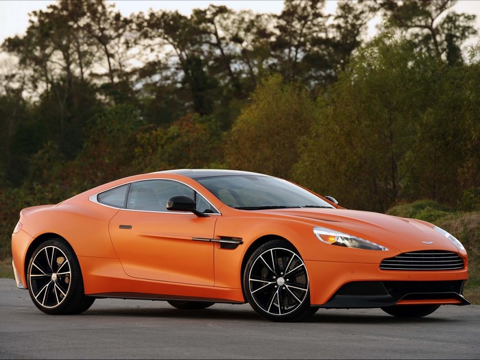 Orange Aston Martin Vanquish parked outdoors