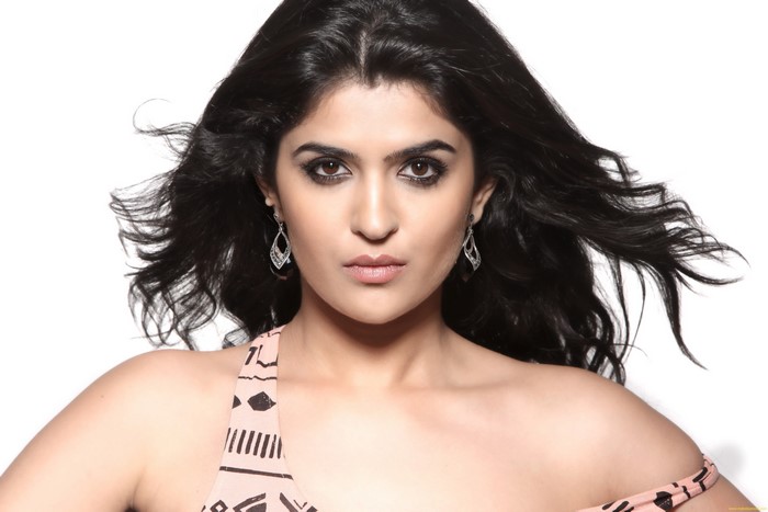 Deeksha Seth wearing earrings
