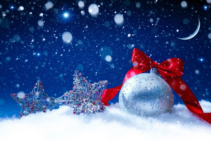 Christmas ornaments and stars in snow