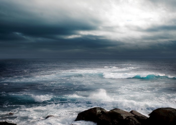 Stormy sea with dark clouds over the ocean