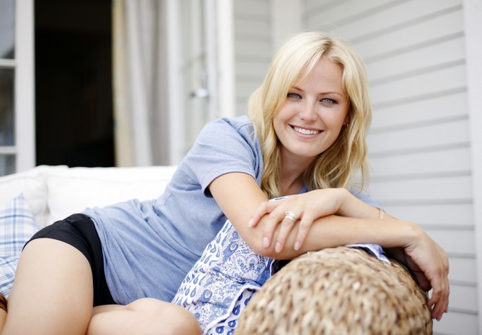 Malin Akerman Smiling on a Couch