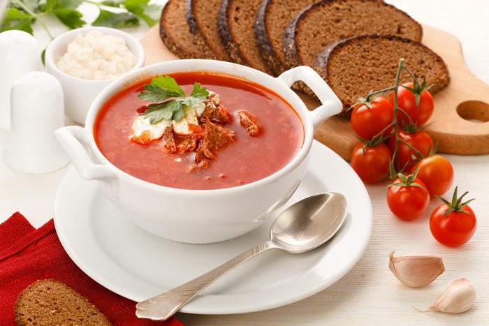 Borscht soup with bread and tomatoes