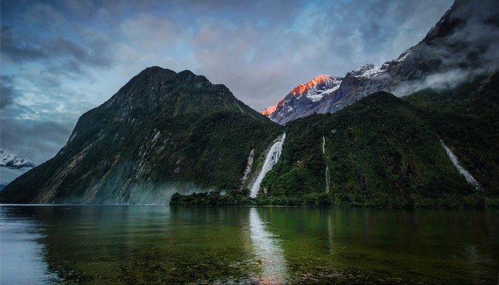 Waterfalls and mountains in Fiordland, New Zealand