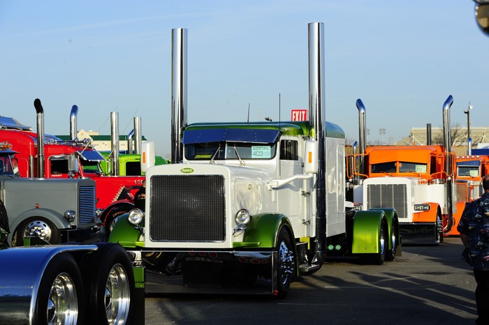 Peterbilt trucks at an outdoor event