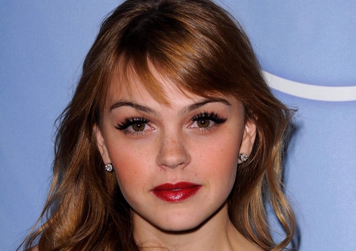 Aimee Teegarden with red lips and earrings