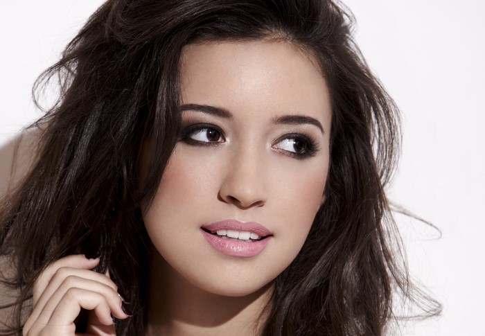 Christian Serratos looking to the side