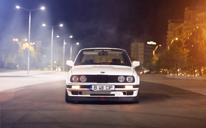 White BMW E30 at Night with Street Lights