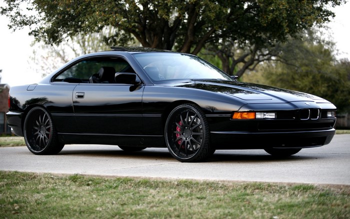 Black BMW 8 Series Coupe on a Road