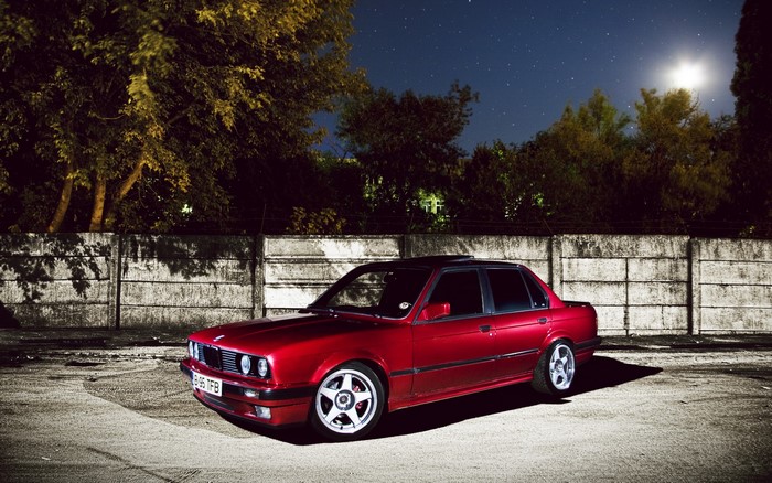 Red BMW Sedan at Night