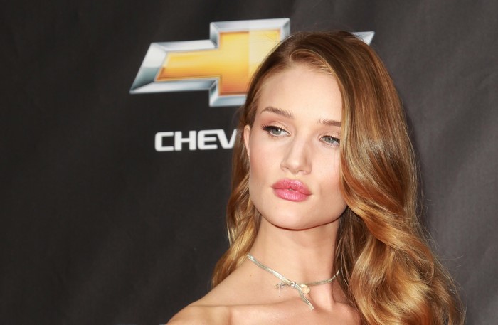 Rosie Huntington-Whiteley in front of Chevrolet logo