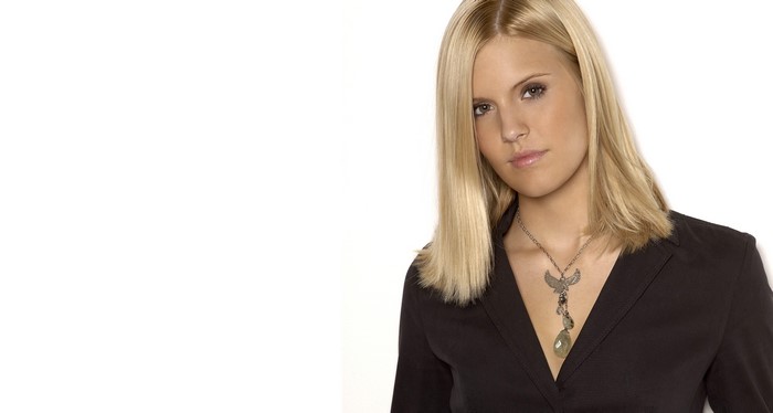 Maggie Grace blonde woman wearing black blazer