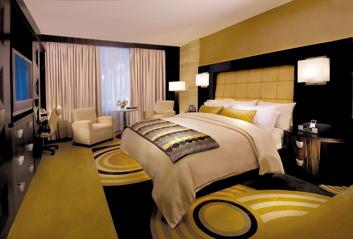 Luxurious hotel bedroom with king-size bed and seating area
