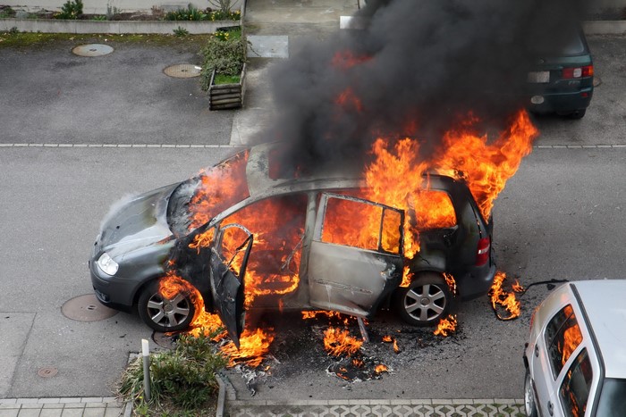 Car on fire in a street