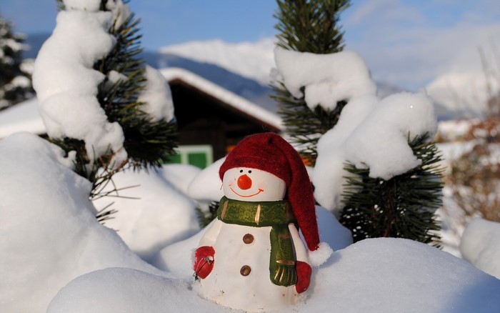 Snowman decoration in a snowy landscape
